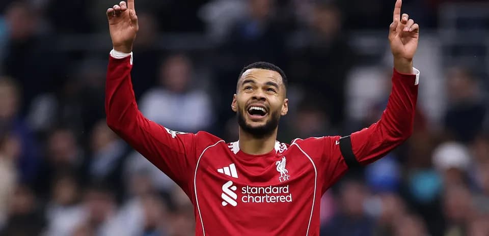 Player celebrating with arms raised after scoring