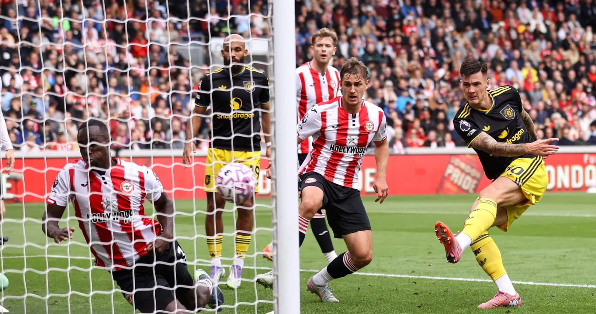 Brentford player attempting to block a shot