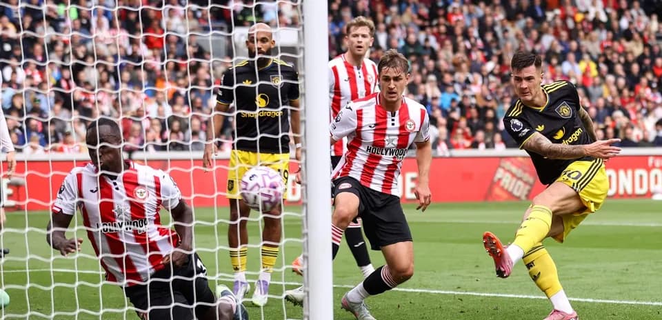Brentford player attempting to block a shot