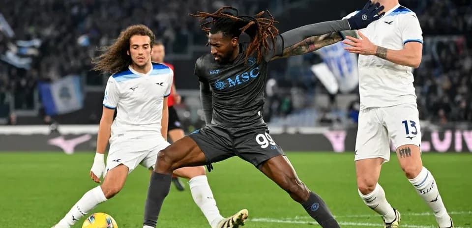 Player challenging for the ball in Serie A match
