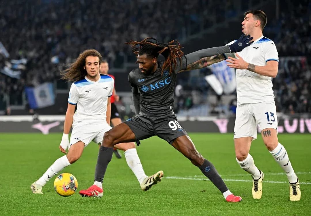 Player challenging for the ball in Serie A match