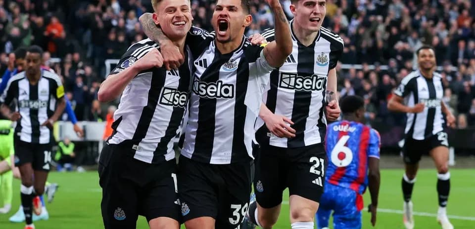 Newcastle players celebrating a goal during match