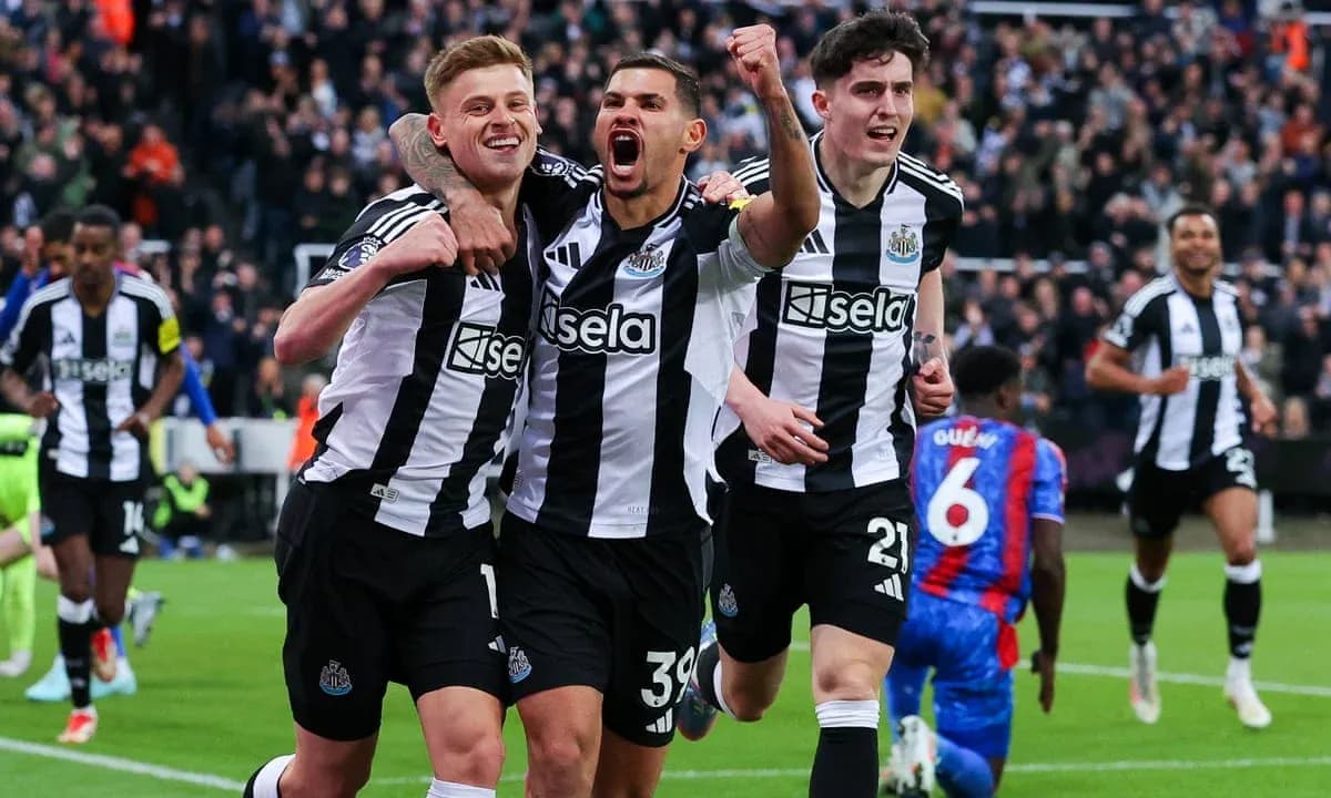Newcastle players celebrating a goal during match