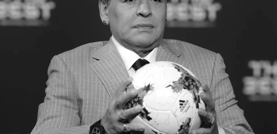 Man holding a soccer ball at an event