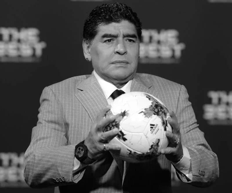 Man holding a soccer ball at an event