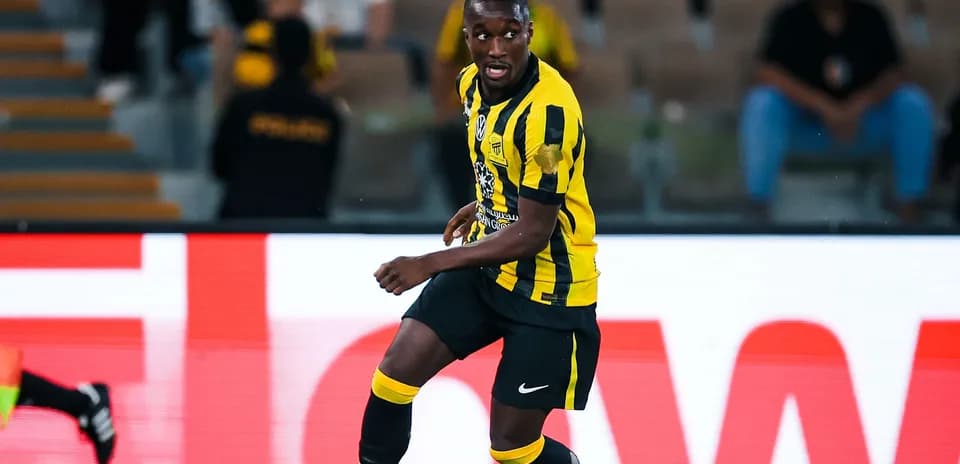 Player in yellow and black jersey during match