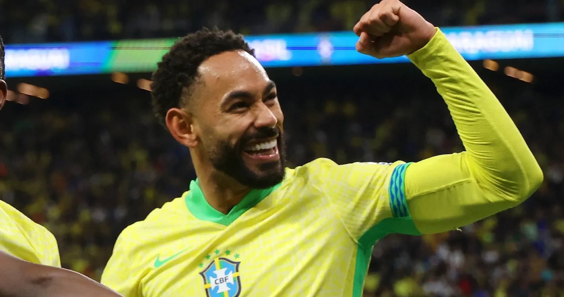 Player celebrating a goal in Brazil national team jersey