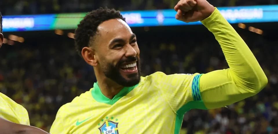 Player celebrating a goal in Brazil national team jersey