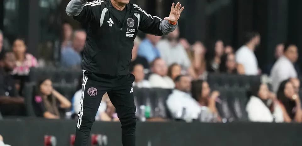 Coach giving instructions from the sidelines during match