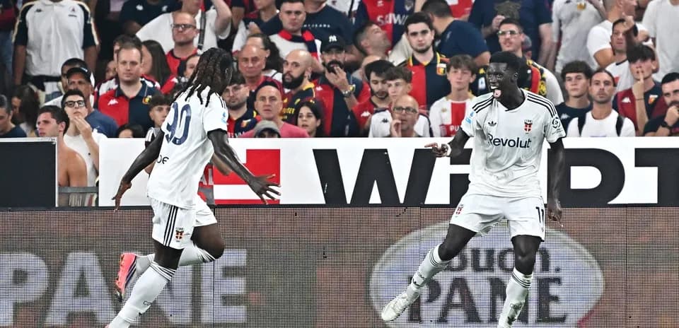 Two players celebrating a goal during match
