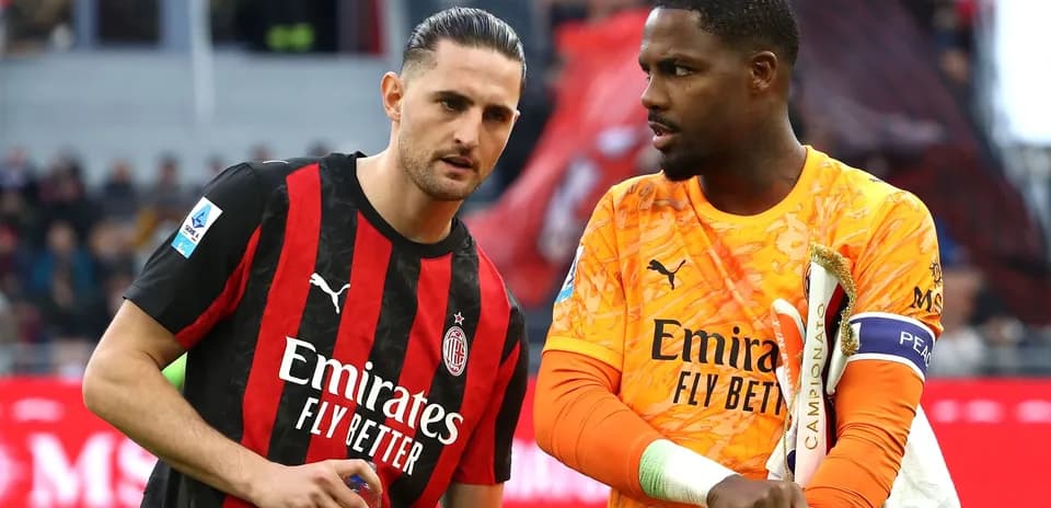 AC Milan players discussing on the pitch