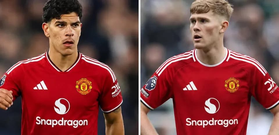 Two Manchester United players in red jerseys