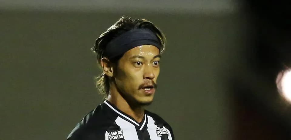 Player in black and white kit during match