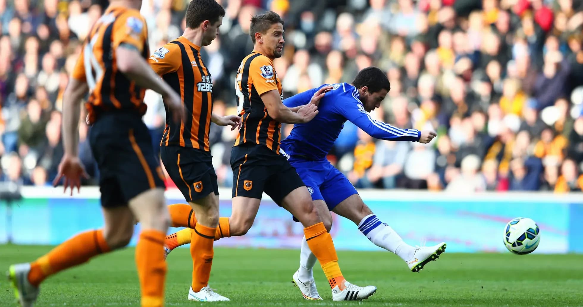 Chelsea player taking a shot against Hull City