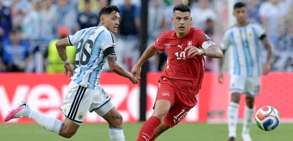 Argentinian player chasing Swiss player during match