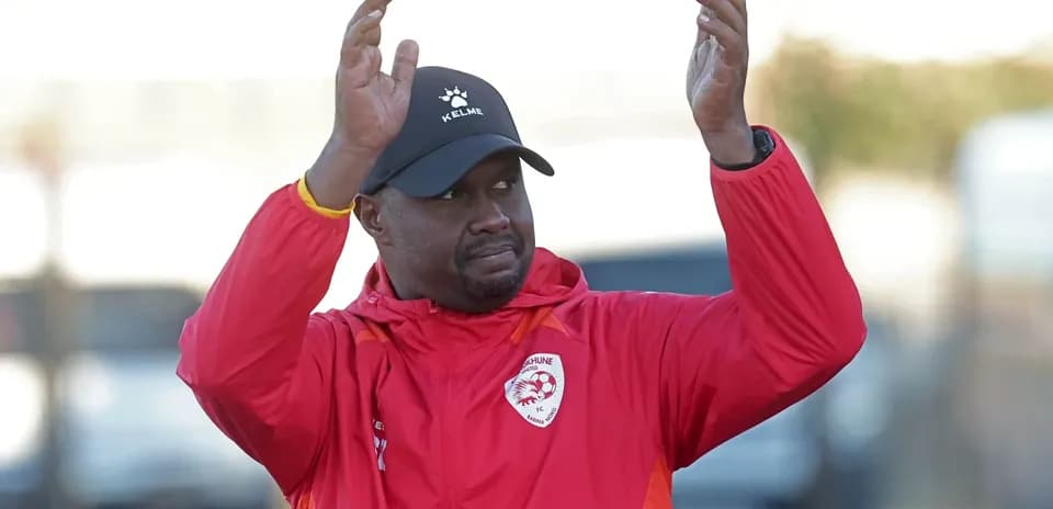 Coach gesturing during training session outdoors
