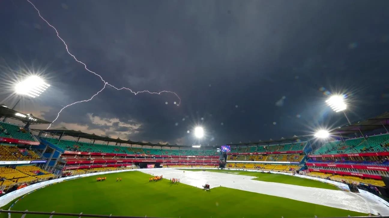 Lightning strikes over covered cricket field in stadium