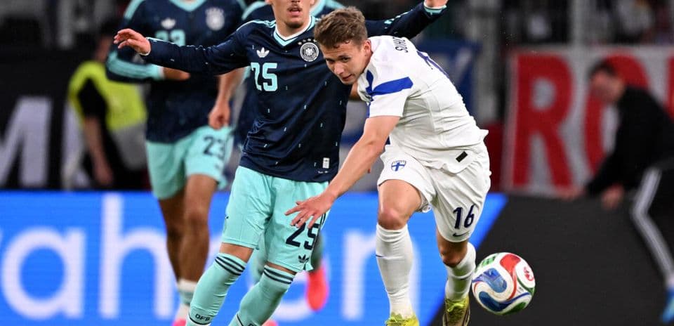 German and Finnish players contesting for the ball