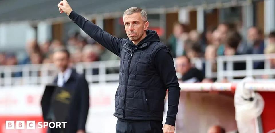 Coach signaling during a football match on sidelines