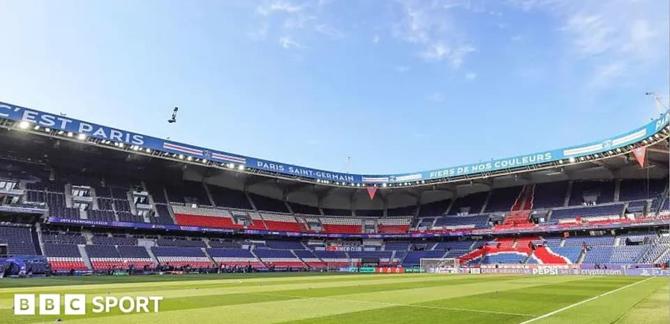 Empty stadium with PSG branding before match