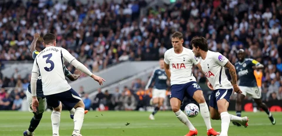 Tottenham players defending during match against opponent