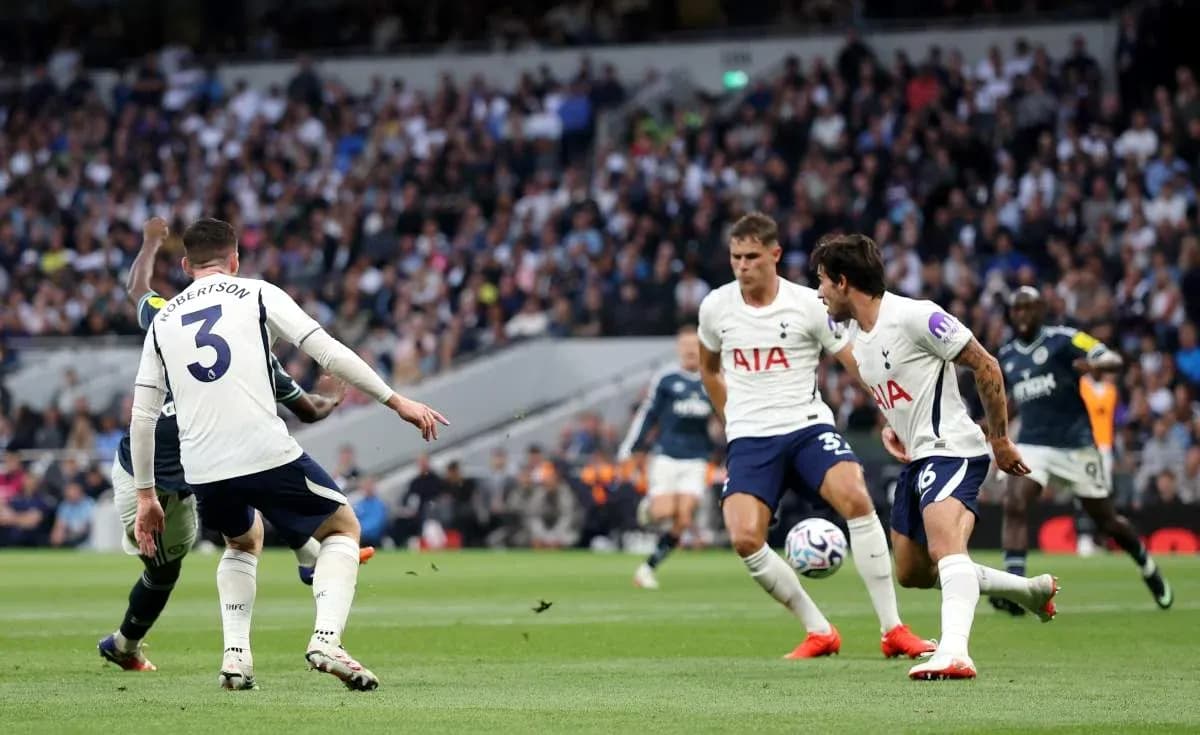 Tottenham players defending during match against opponent