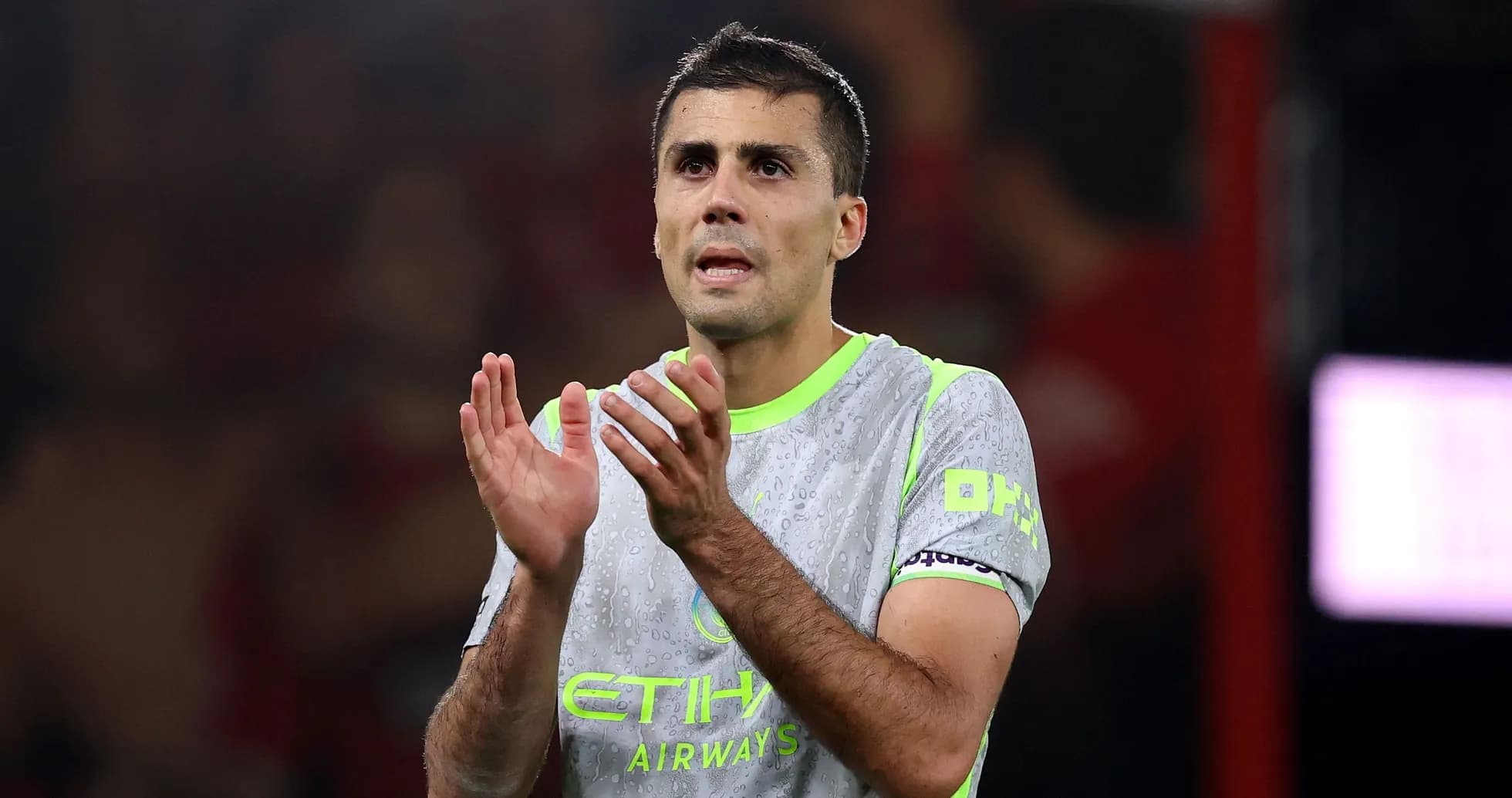 Player applauding fans during match at stadium
