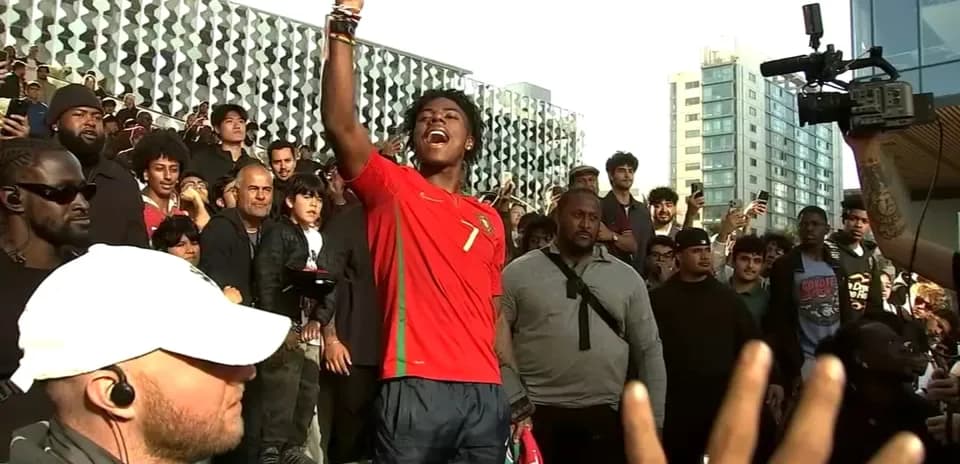 Fan celebrating in Portugal jersey among crowd