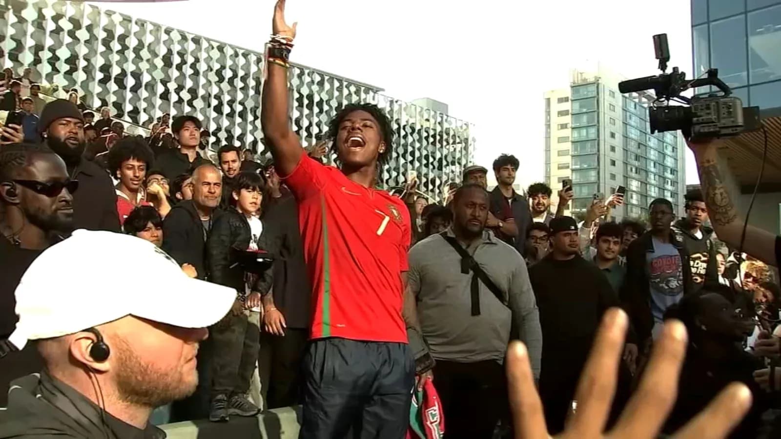 Fan celebrating in Portugal jersey among crowd