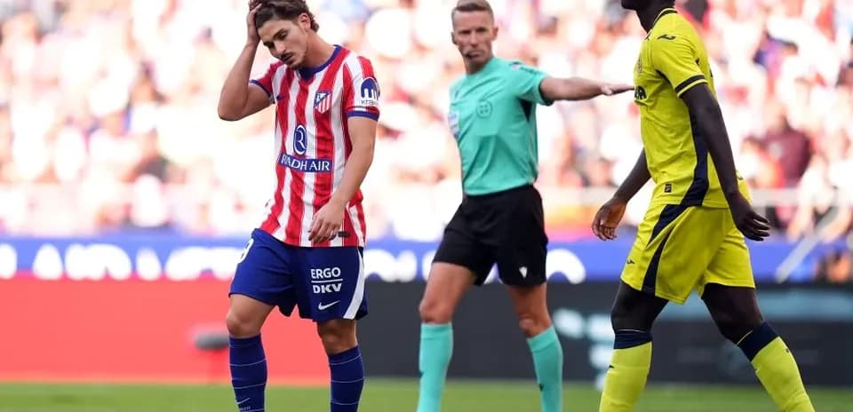 Atletico Madrid player looking frustrated on field