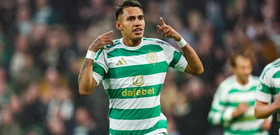 Player celebrating goal in Celtic's green and white kit