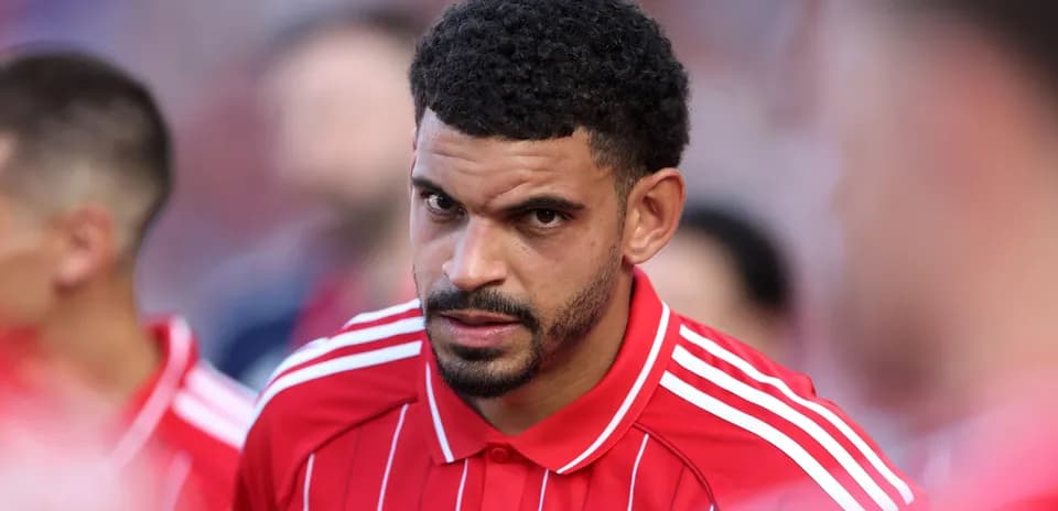 Player in red jersey focused before the match