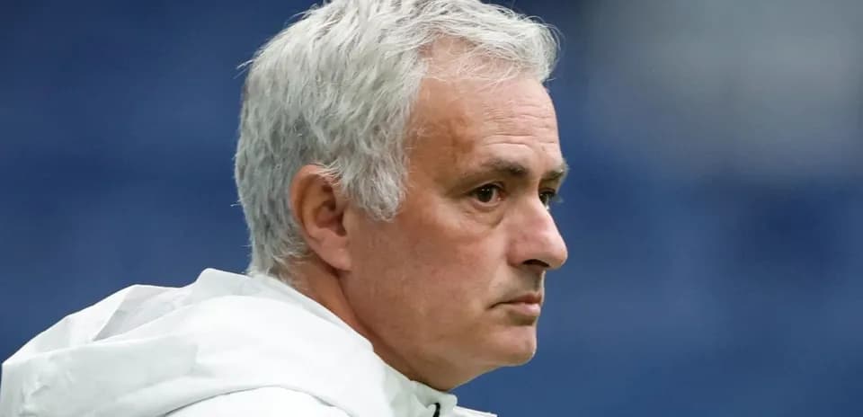 Coach with gray hair in profile view