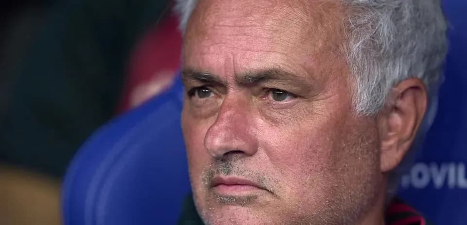 Coach sitting on the bench during a match