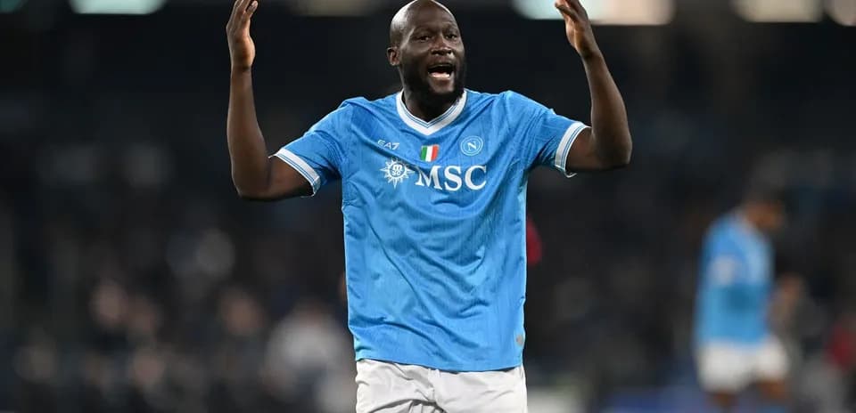 Player celebrating in Napoli home kit during match