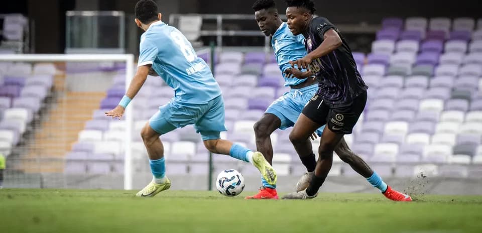 Players competing for the ball during match