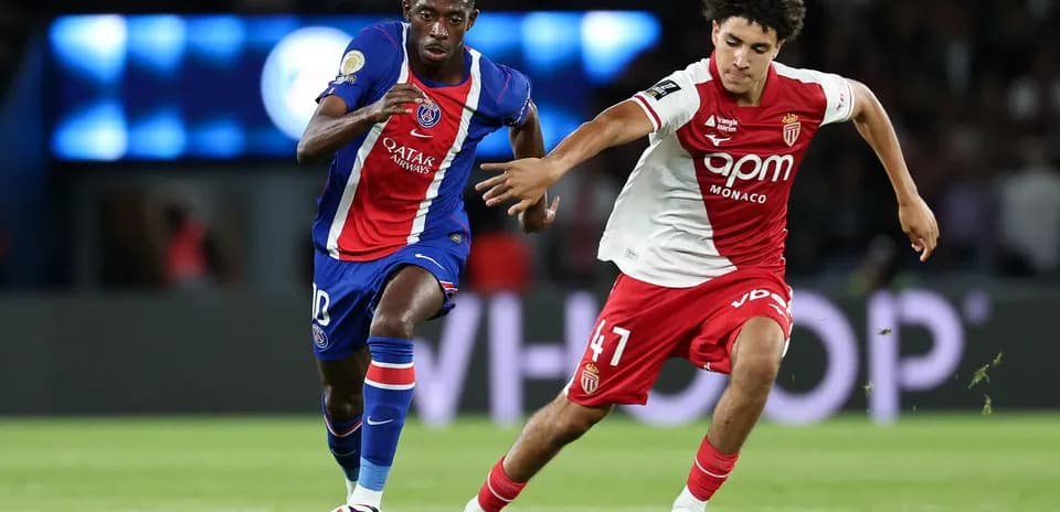 Two players competing for the ball during match