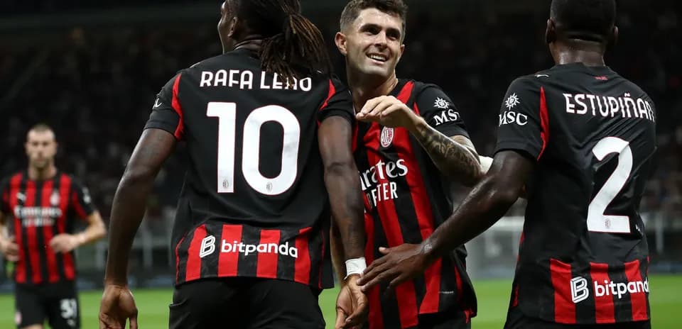 Players celebrating a goal during a match