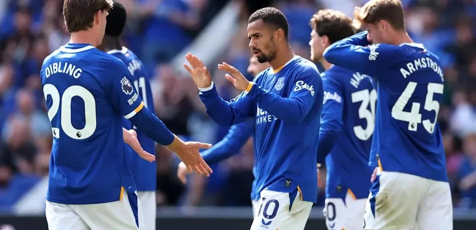 Everton players celebrating during a match