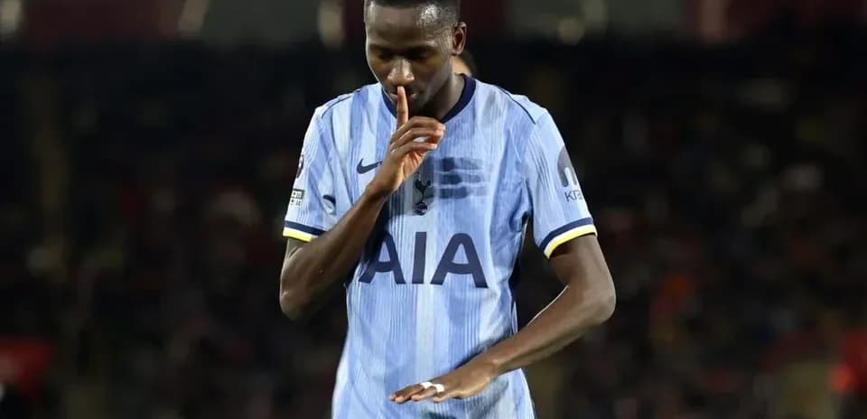 Player making a shushing gesture on the field