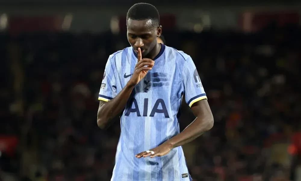 Player making a shushing gesture on the field