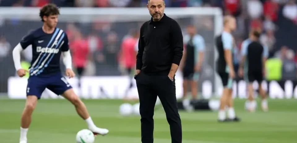Manager observing players during warm-up session