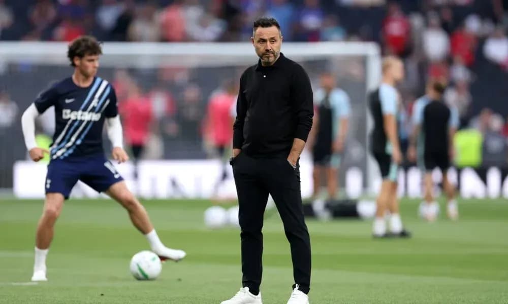 Manager observing players during warm-up session