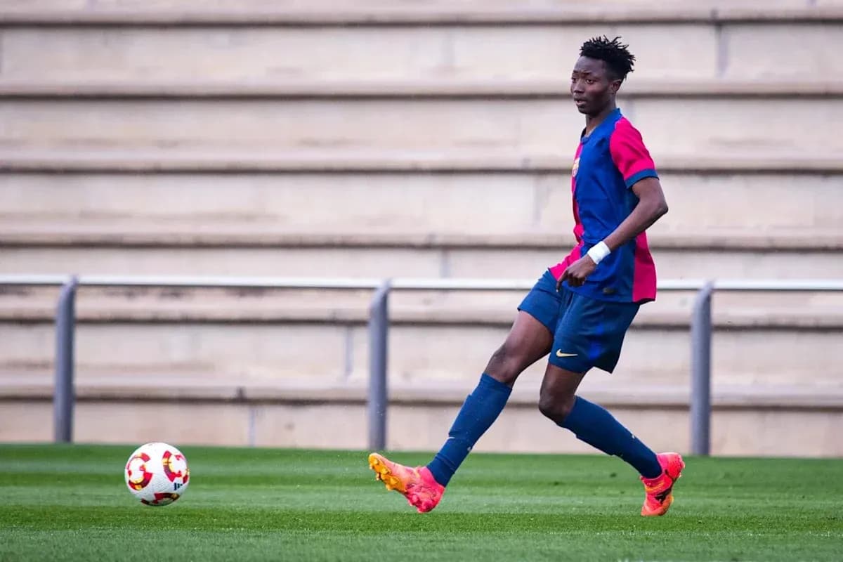 Player in FC Barcelona kit passing the ball Player in FC Barcelona kit passing the ball
