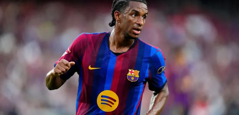 Player in FC Barcelona kit running on field