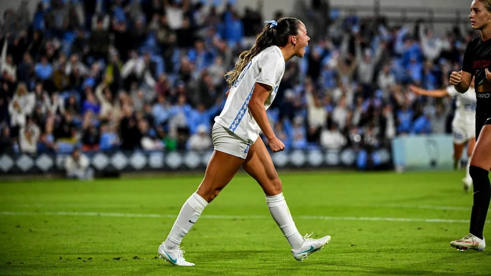 Player celebrating a goal on the field