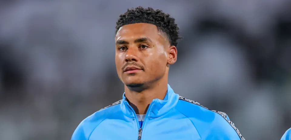 Player in blue team jacket on the field