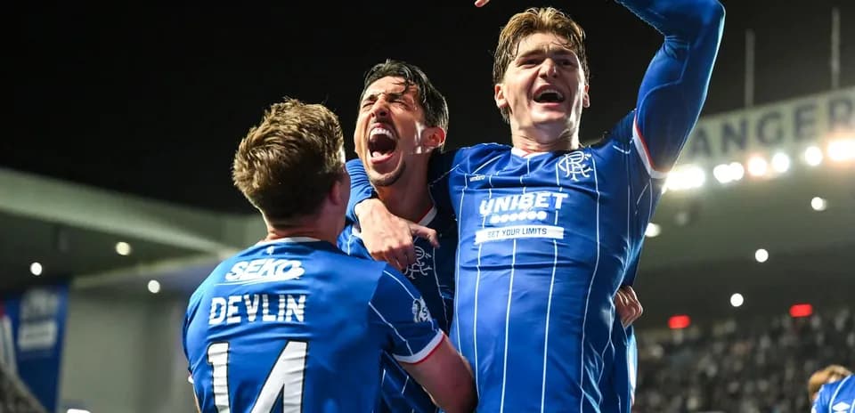 Rangers players celebrating a goal together