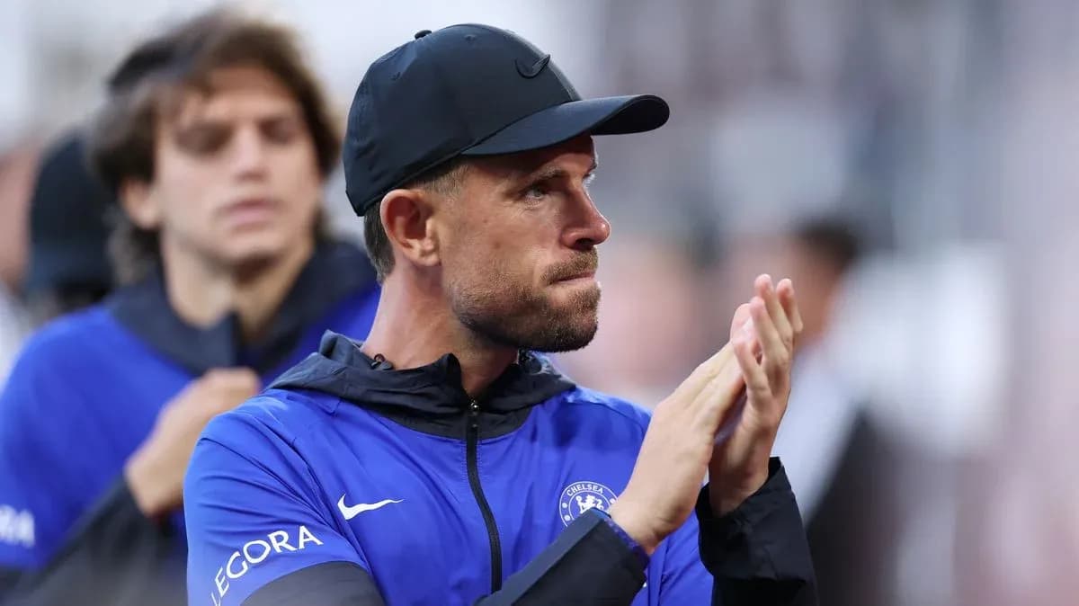 Coach applauding on the sidelines during match