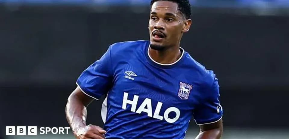 Player in blue jersey running on the field